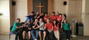A group of people posing for a photo in a church.