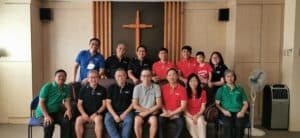 A group of people posing for a photo in a church.