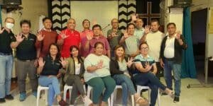 A group of people posing for a photo in a church.