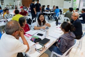 A group of people sitting at tables in a room.