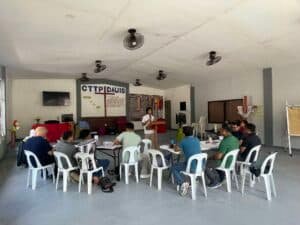 A group of people sitting at tables in a room.